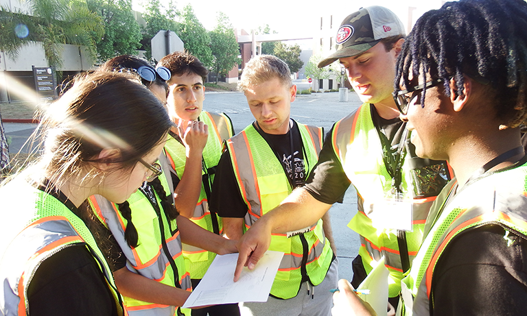Civil and environmental engineering students review site information during a student competition. The department’s new geospatial engineering subdiscipline will help students work with location-based data and better understand the places where civil engineering projects take shape.