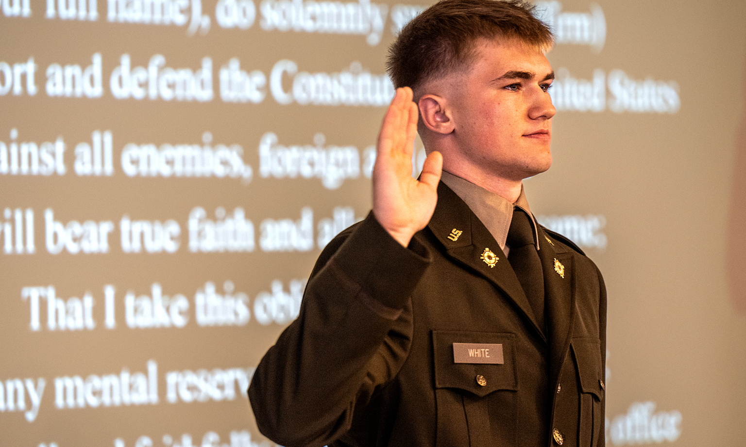 Avery White, a computer engineering graduate, takes the Oath of Commissioned Officers during Cal Poly Army ROTC’s spring commissioning ceremony June 13 at the Officers’ Club at Camp San Luis Obispo.