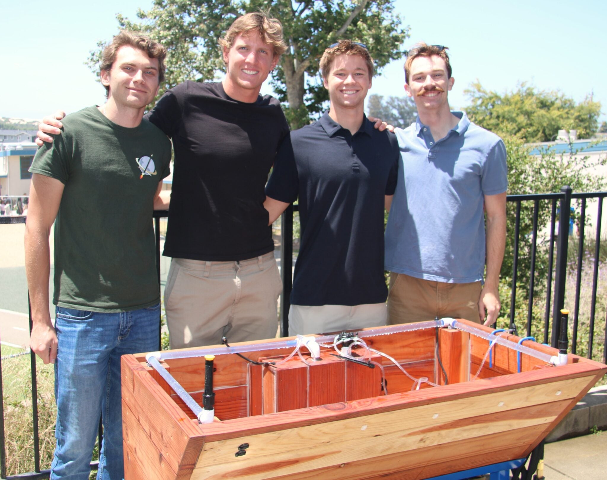 Matthew Podgorski, from left, Lucas Meneghetti, Alex Seybold and Gabe Haarberg gather behind the garden box after bringing it to Heather McColley’s classroom at Oceano Elementary School. 