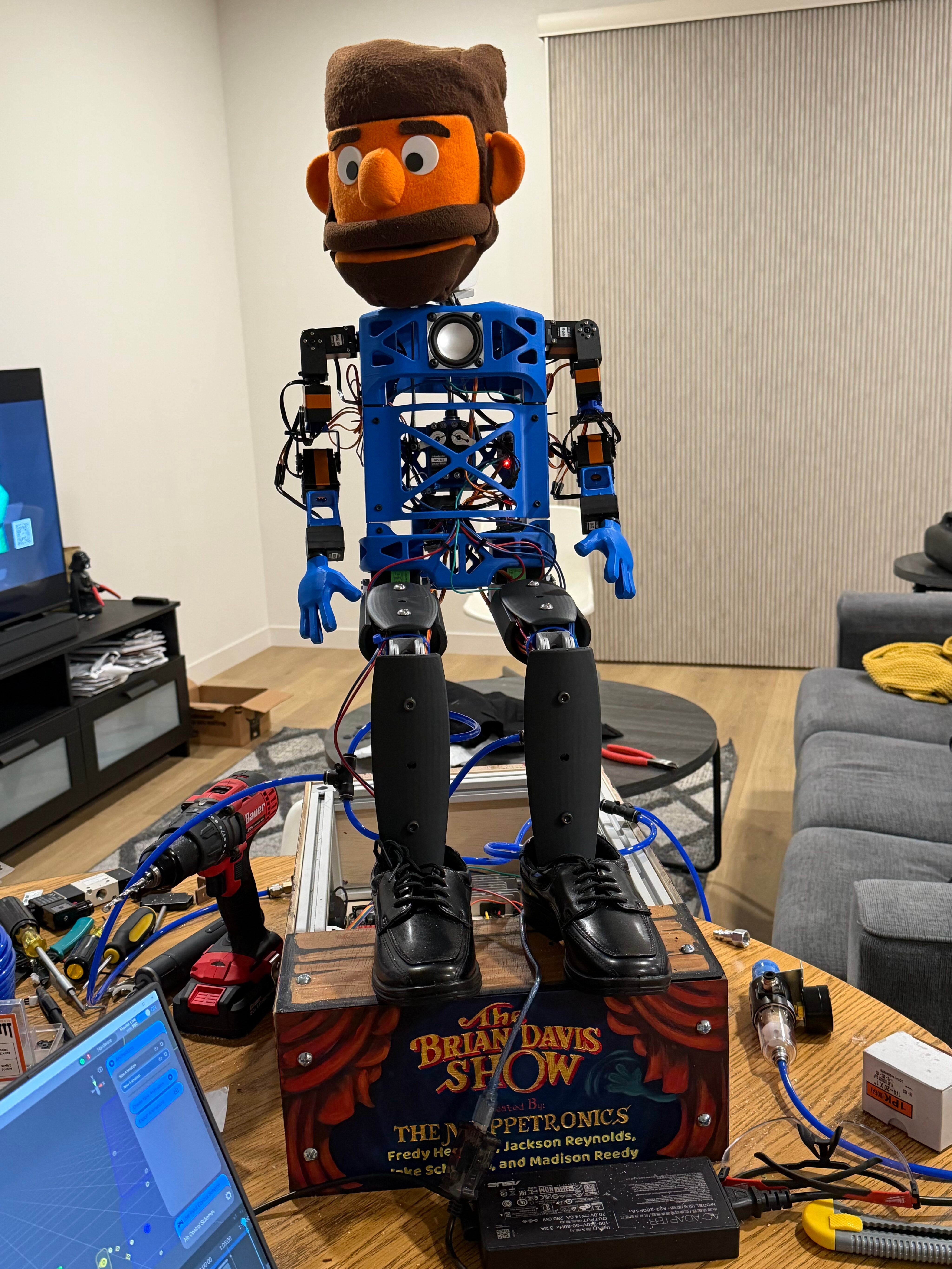 An in-progress version of “The Brian Davis Show” shows the puppet’s frame, wiring and control system before the team added its finished costume.