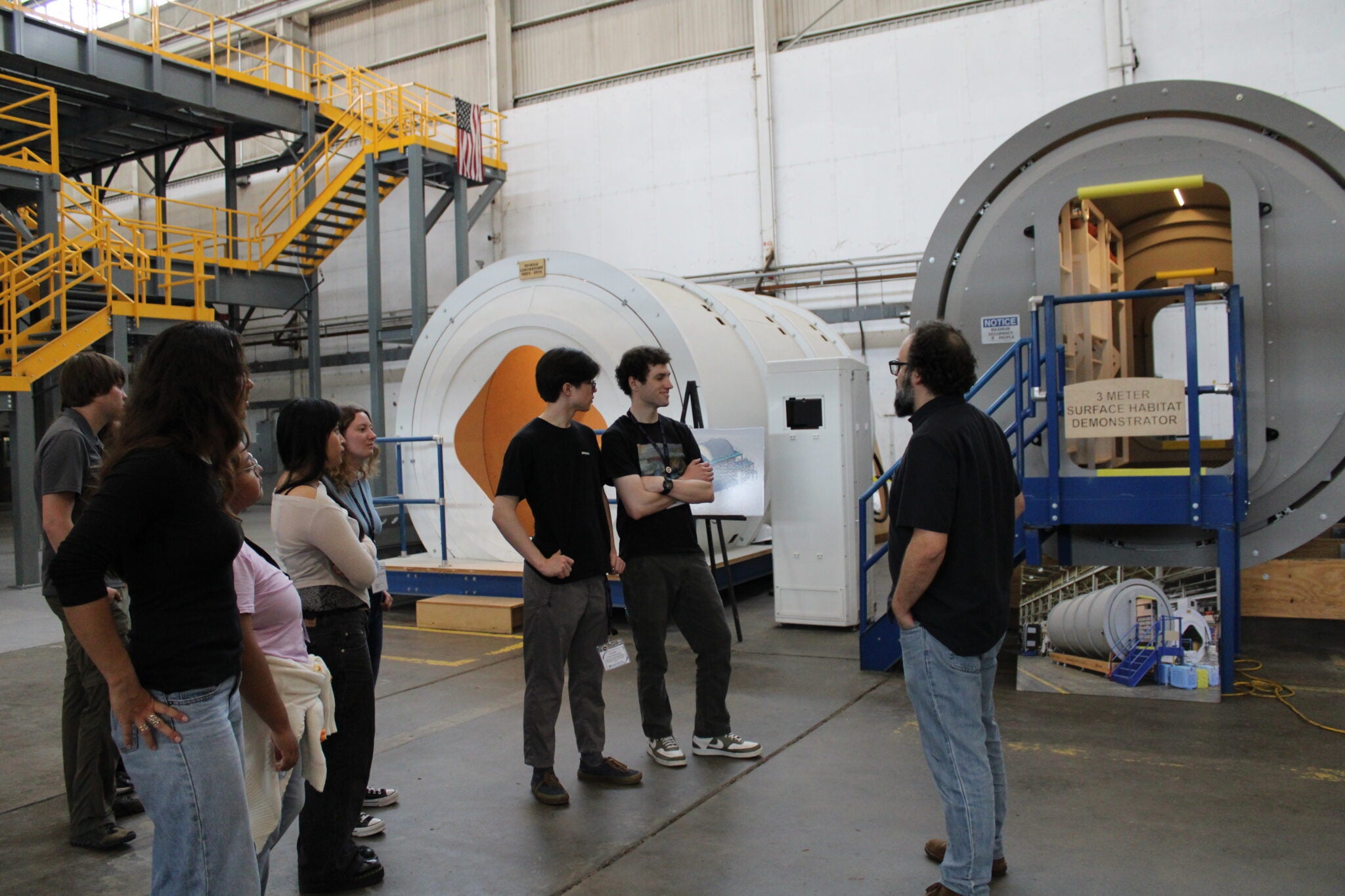 Cal Poly students tour a NASA surface habitat demonstration facility at Marshall Space Flight Center during the 2026 Human Lander Challenge forum in Huntsville, Alabama.
