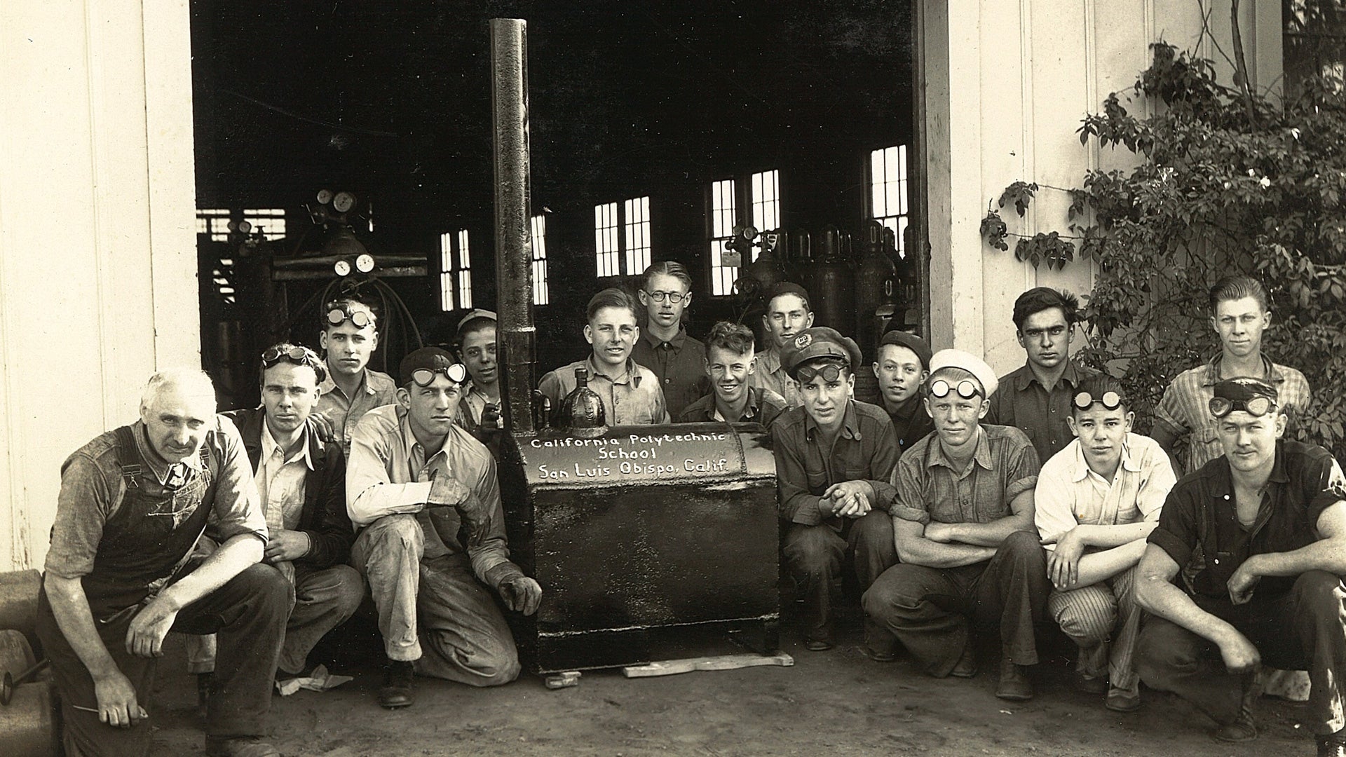 Cal Poly students pose with shop equipment at the California Polytechnic School in an early era of hands-on engineering training.