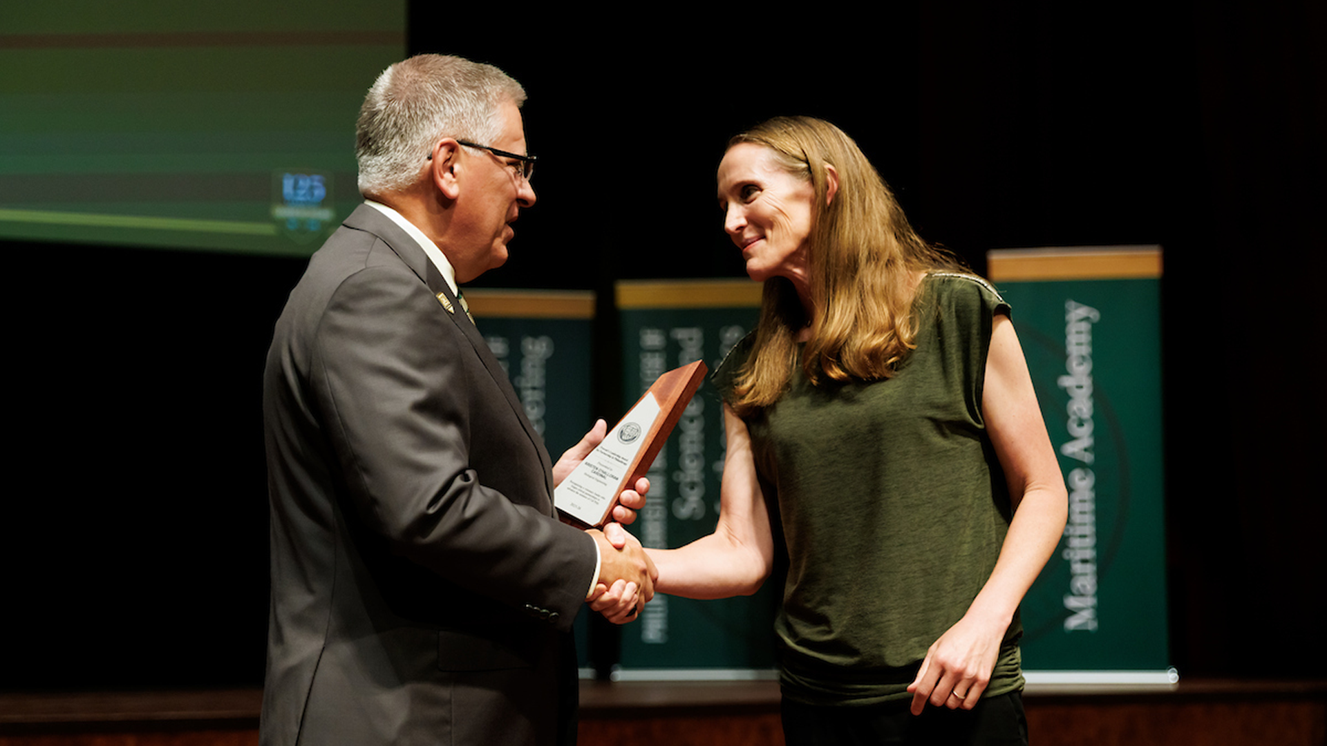 Professor receives award from president on stage