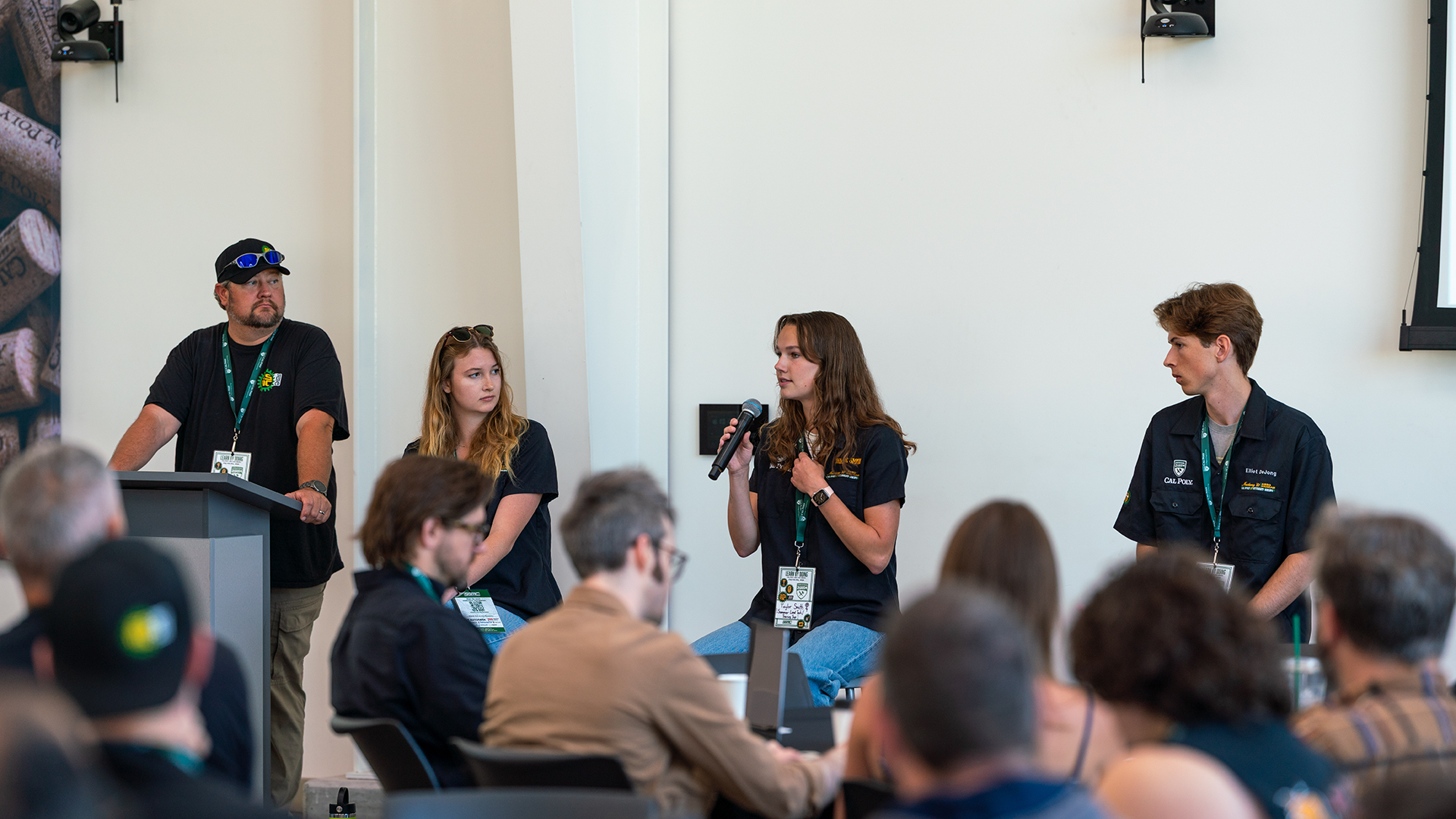 students speak during panel presentation