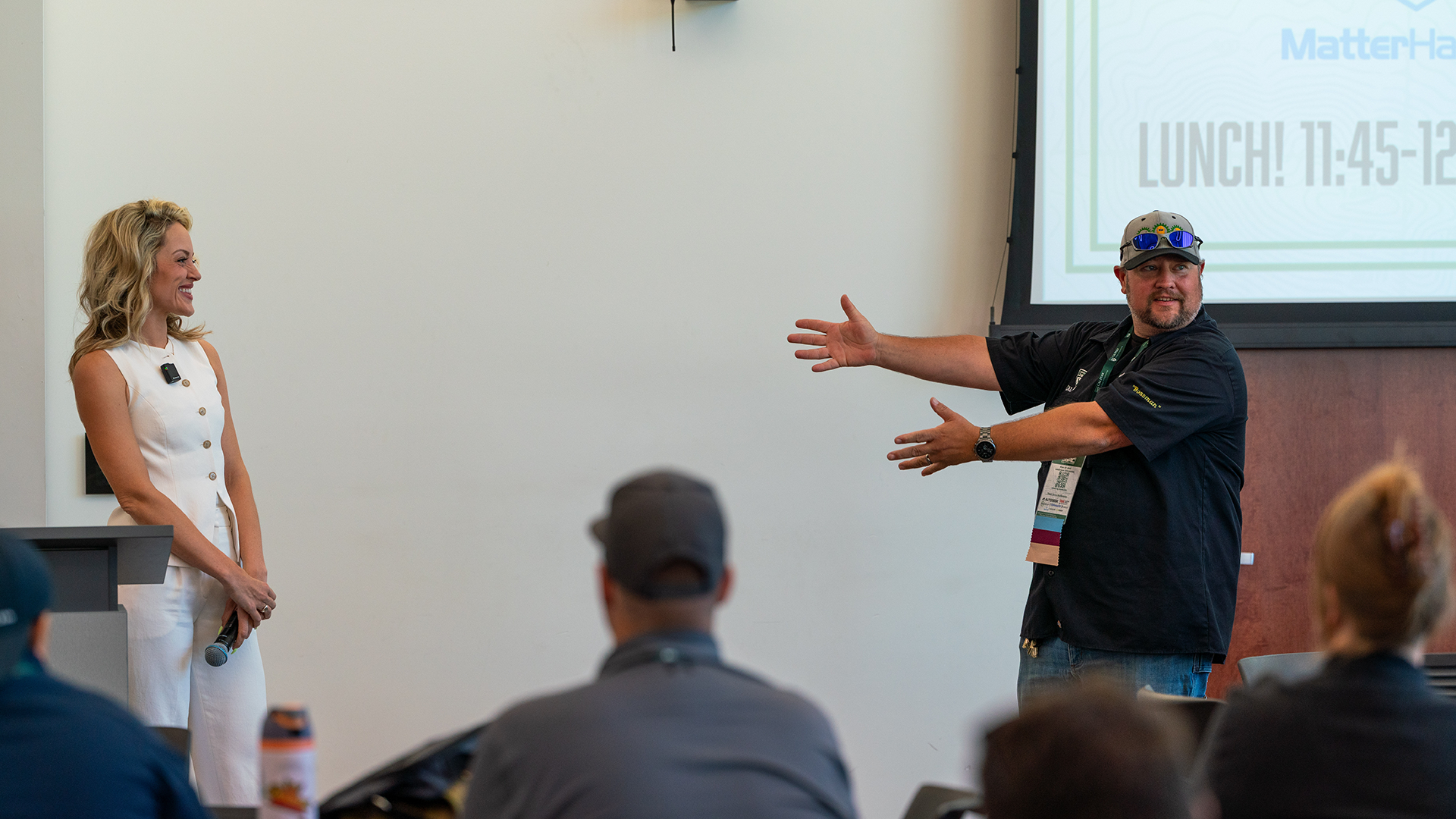 Shop manager introduces speaker before the keynote address
