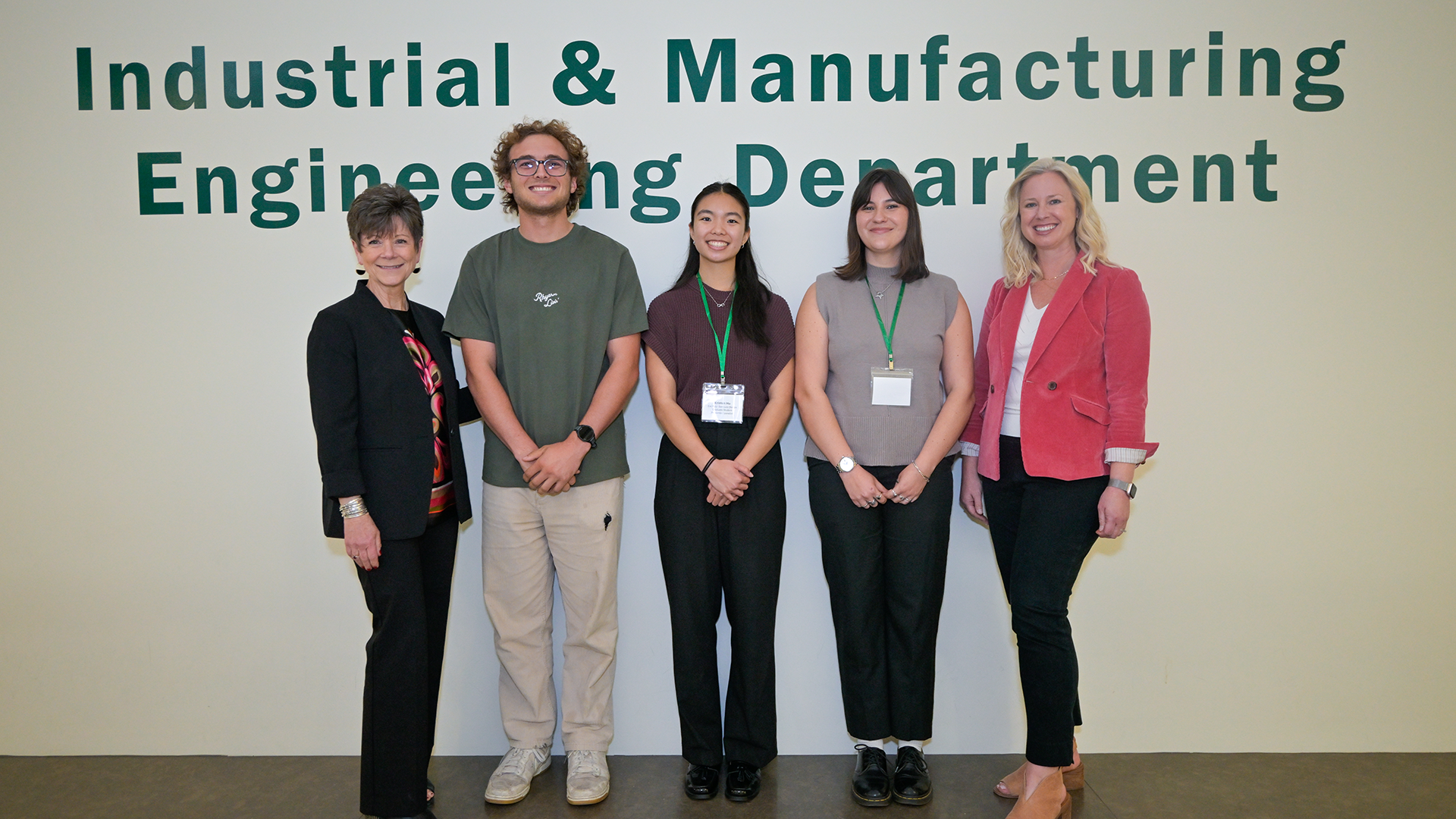 Group photo in front of IME Department sign