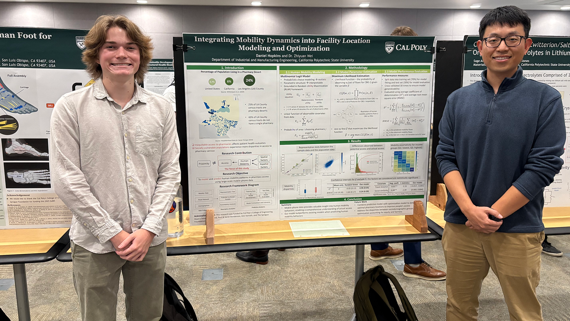 Professor stands with student in front of research poster
