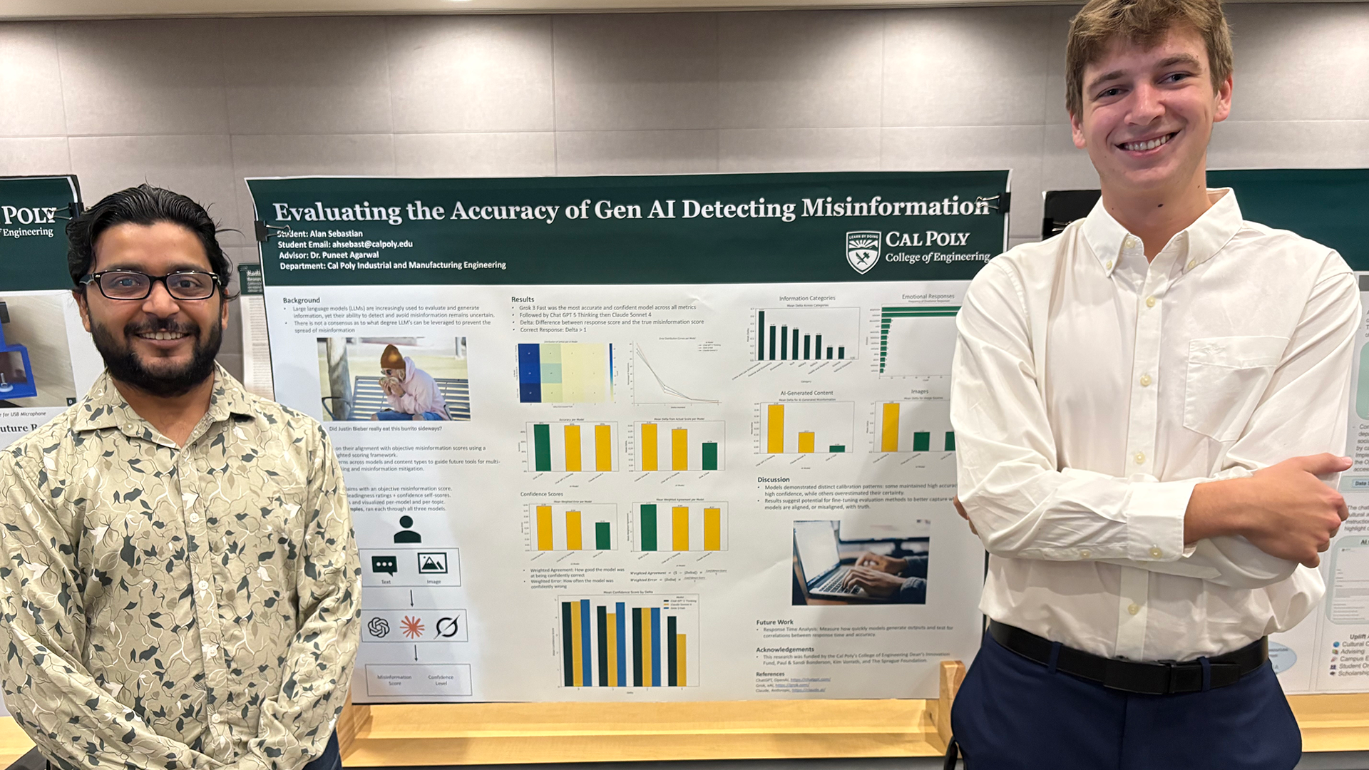 Professor stands with student in front of research poster