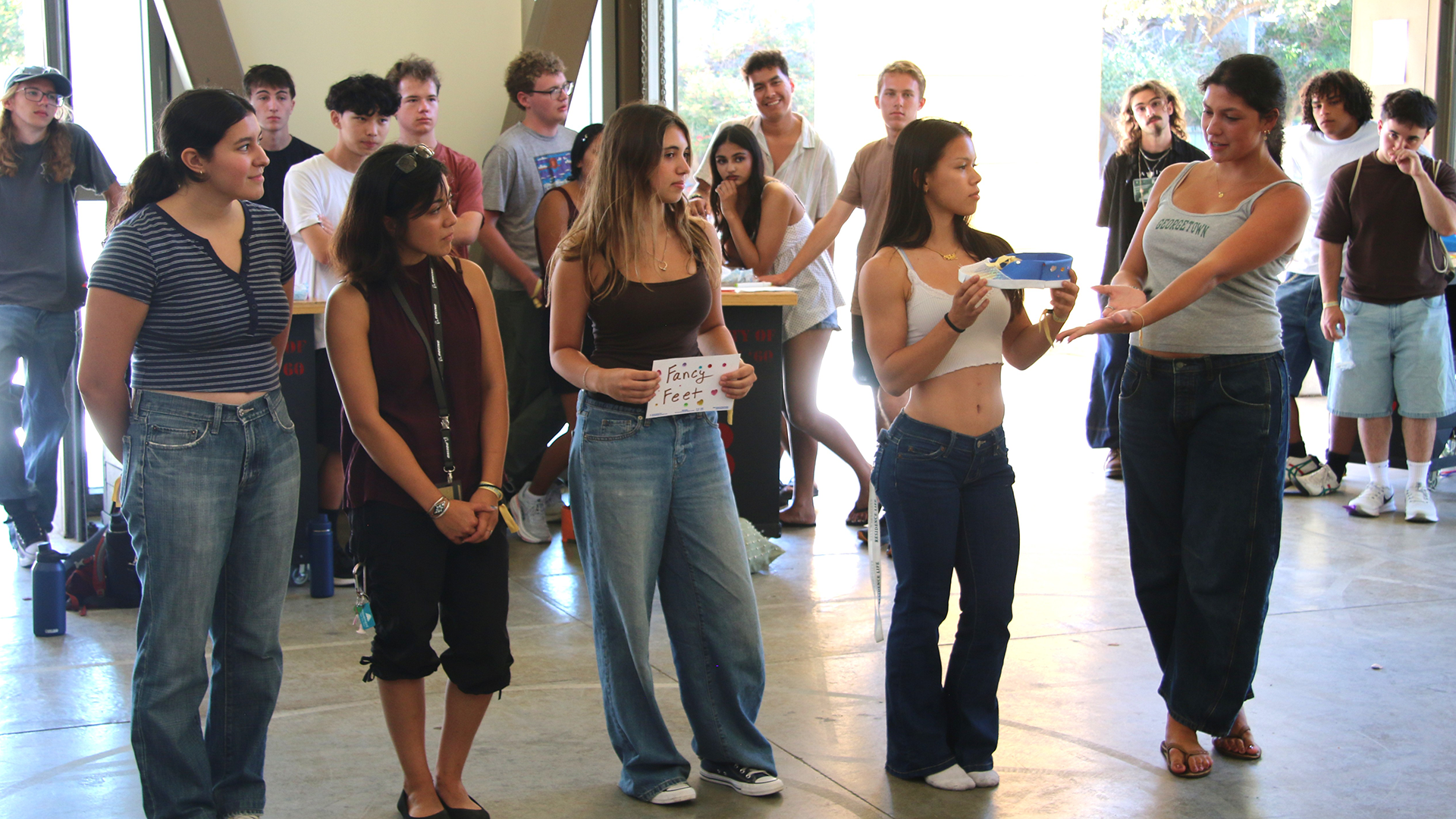 Students pitch their shoe during a WOW event