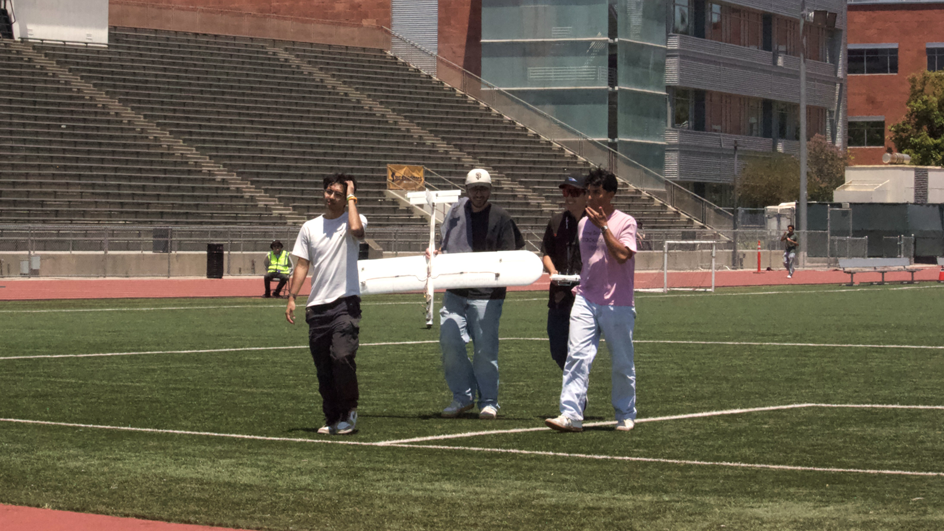 Student walks off field with plane