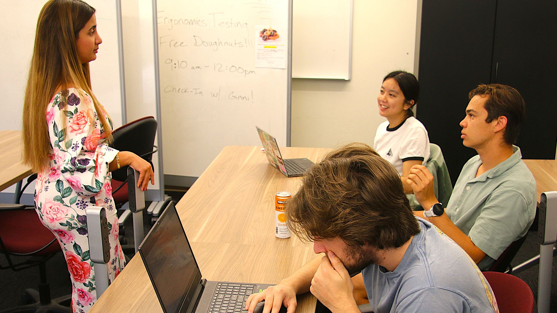Students chat with professor about their project