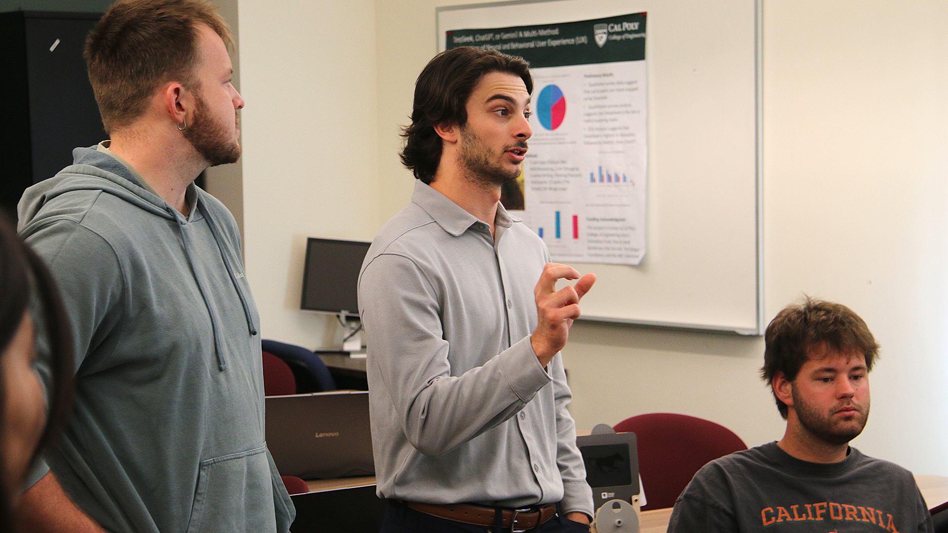Student discusses project as classmates listen