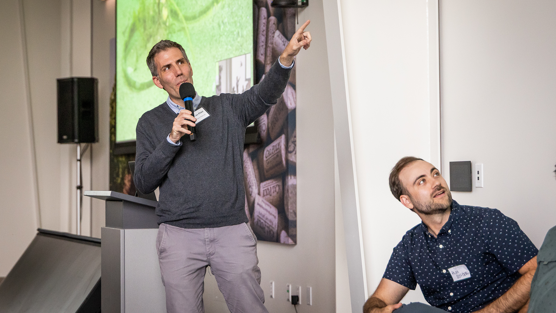 Speaker points to slide during presentation