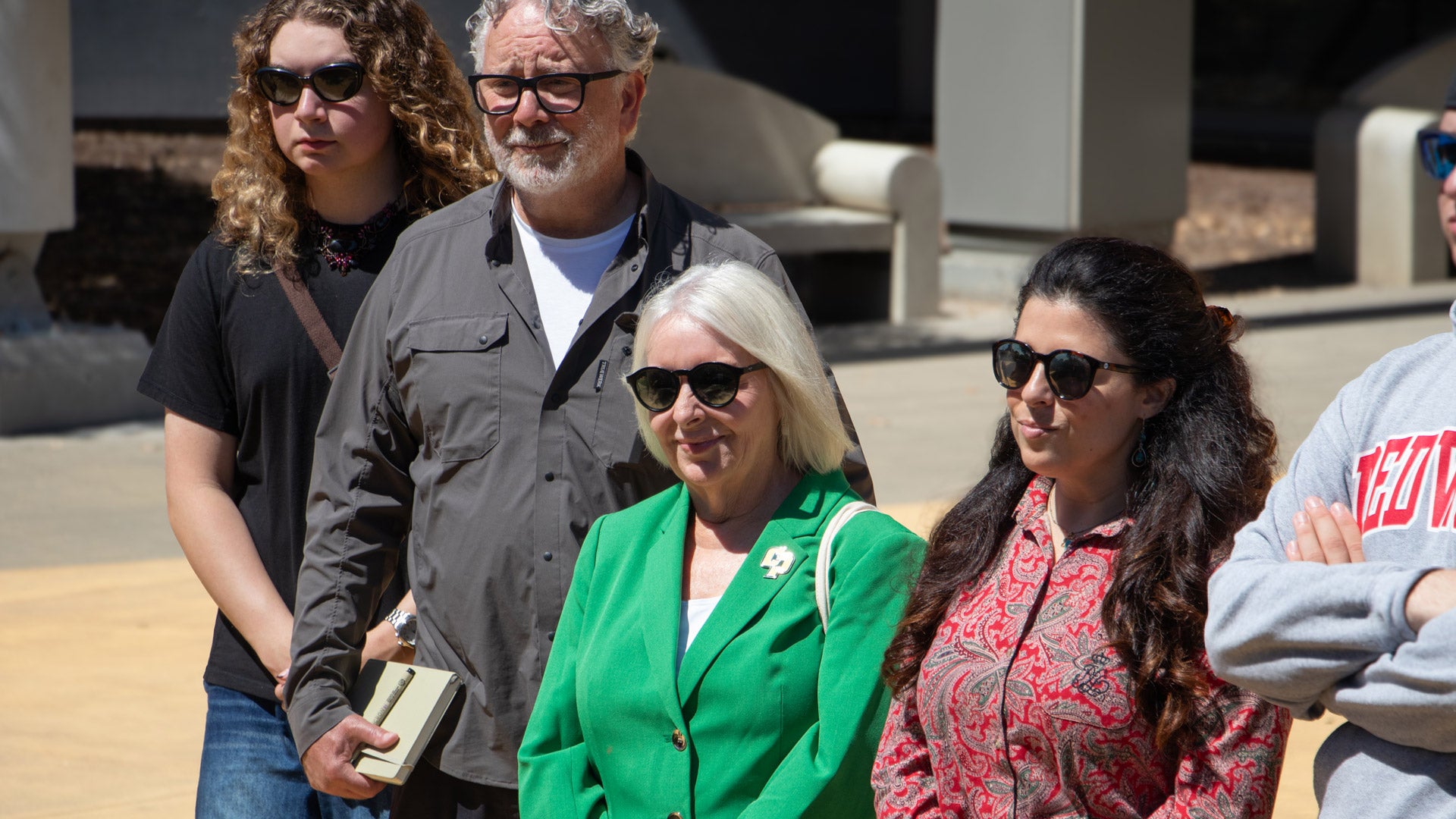 Interim Dean Lynnette Zelezny and others listening during a college tour