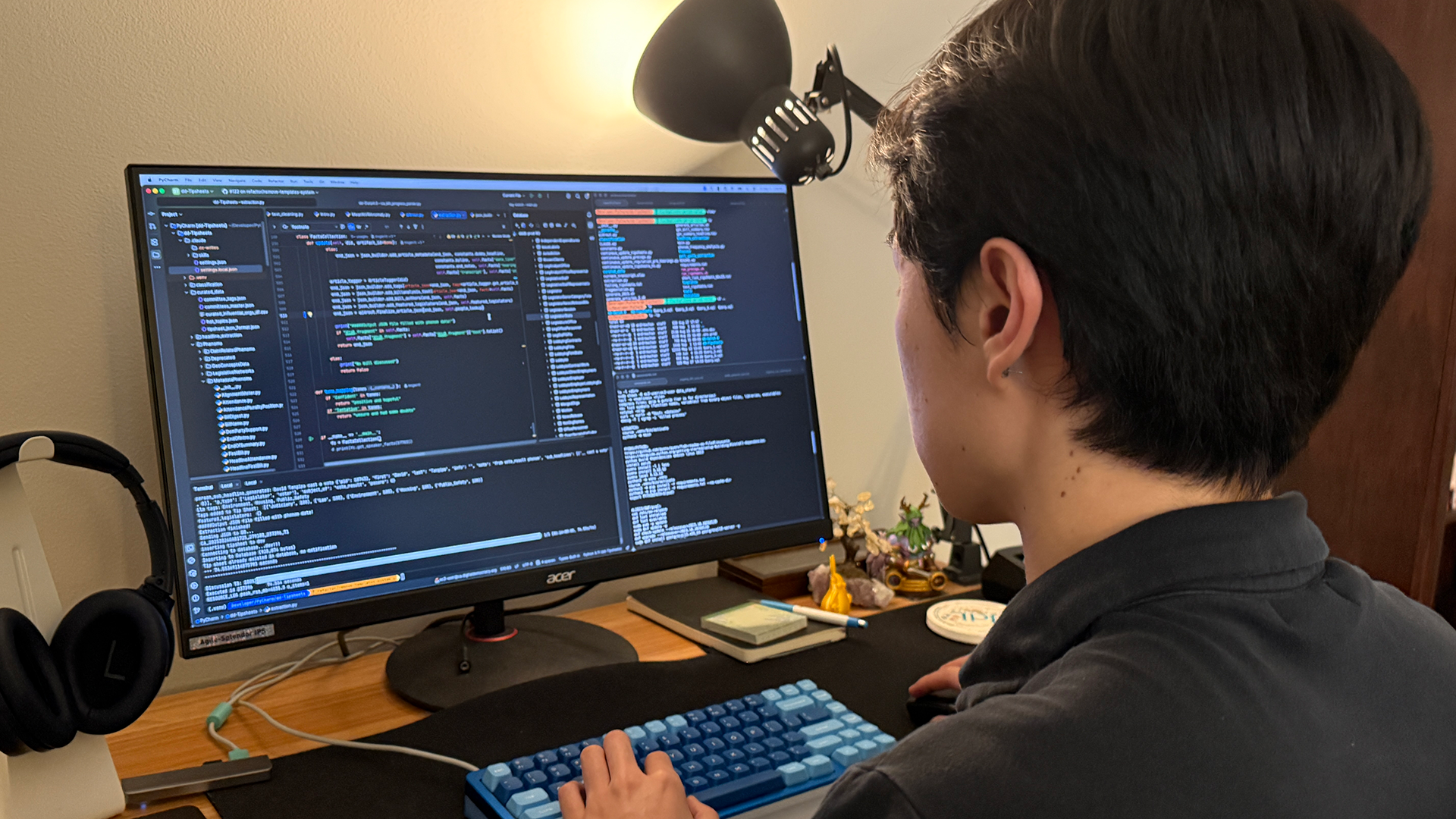 Alumnus sits at laptop 
