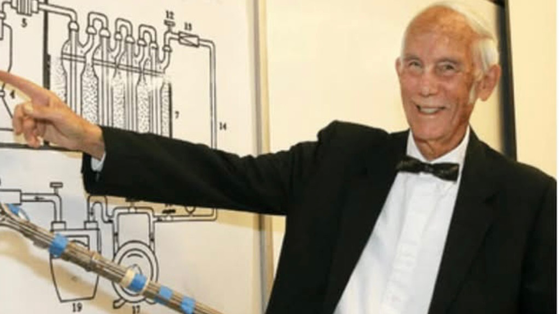 Professor pointing to diagram