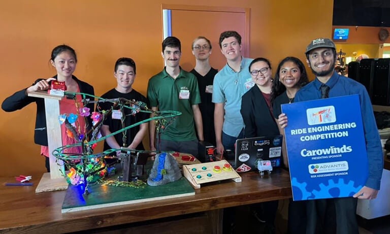 CAPED members pose with their model roller coaster