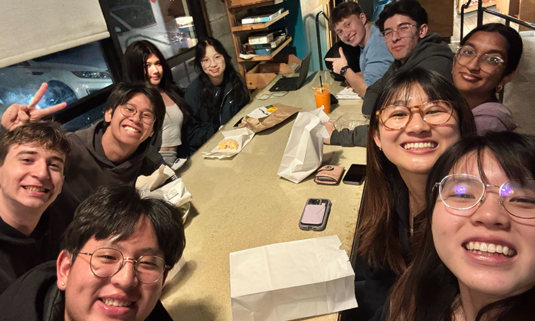 Group of students gather for donuts