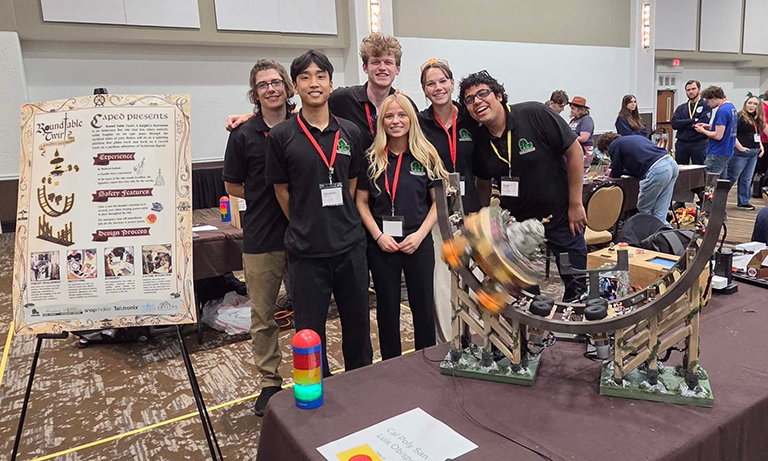 Team members pose with award-winning ride