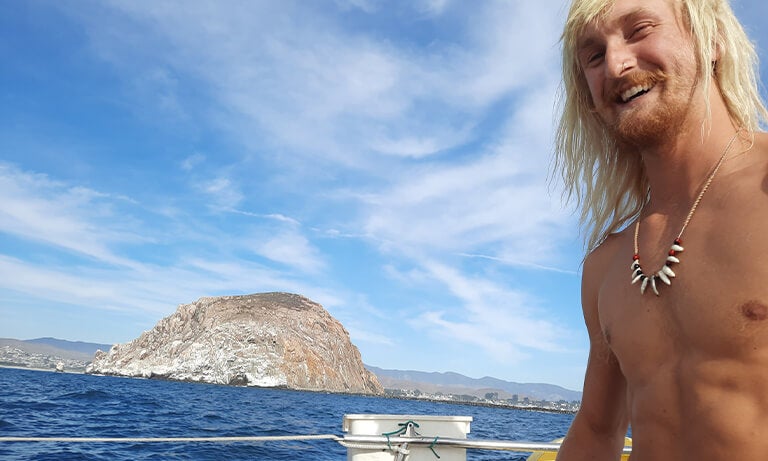 Student sails by Morro Rock