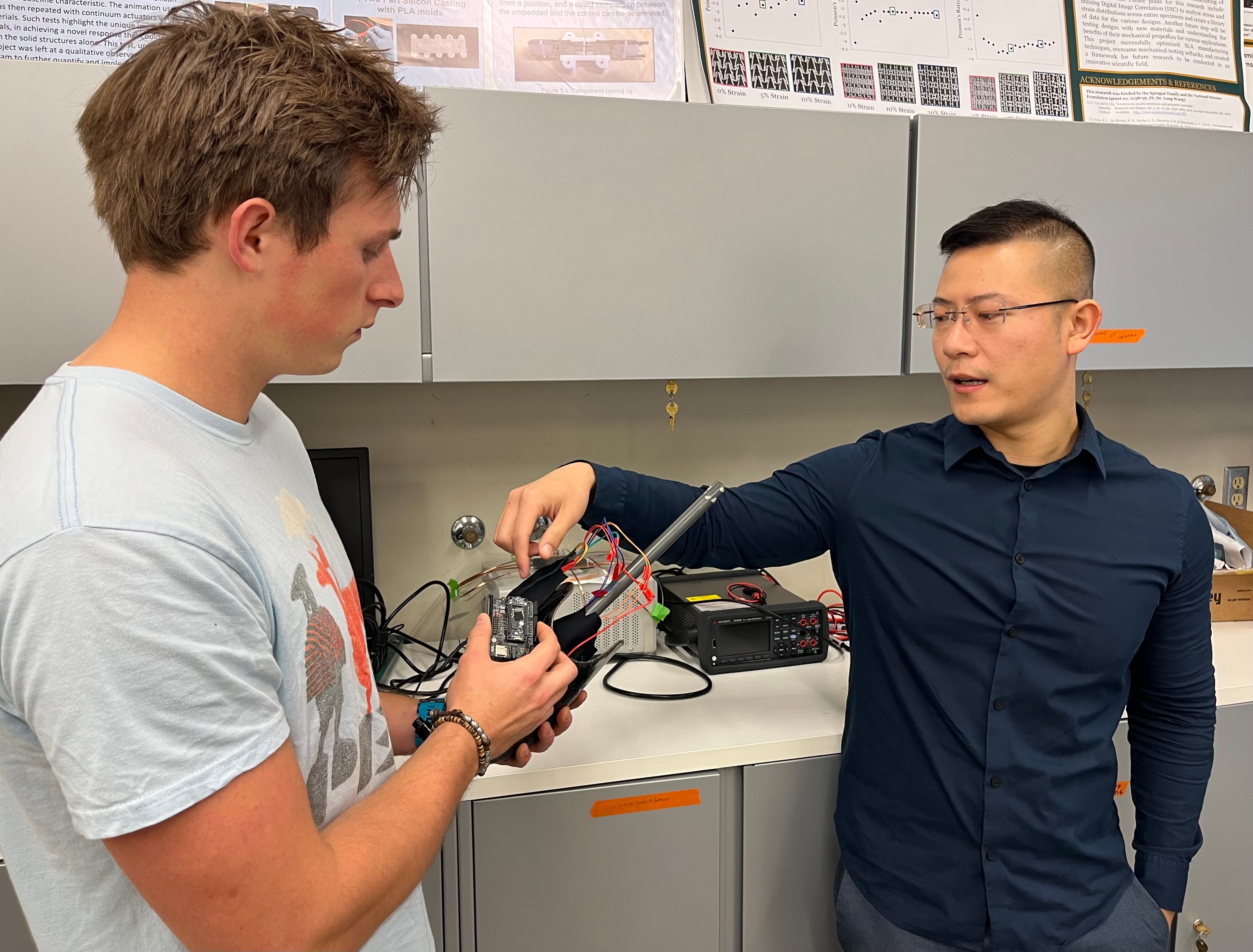 Professor and master's student talk about a collaboration with Sony in a lab