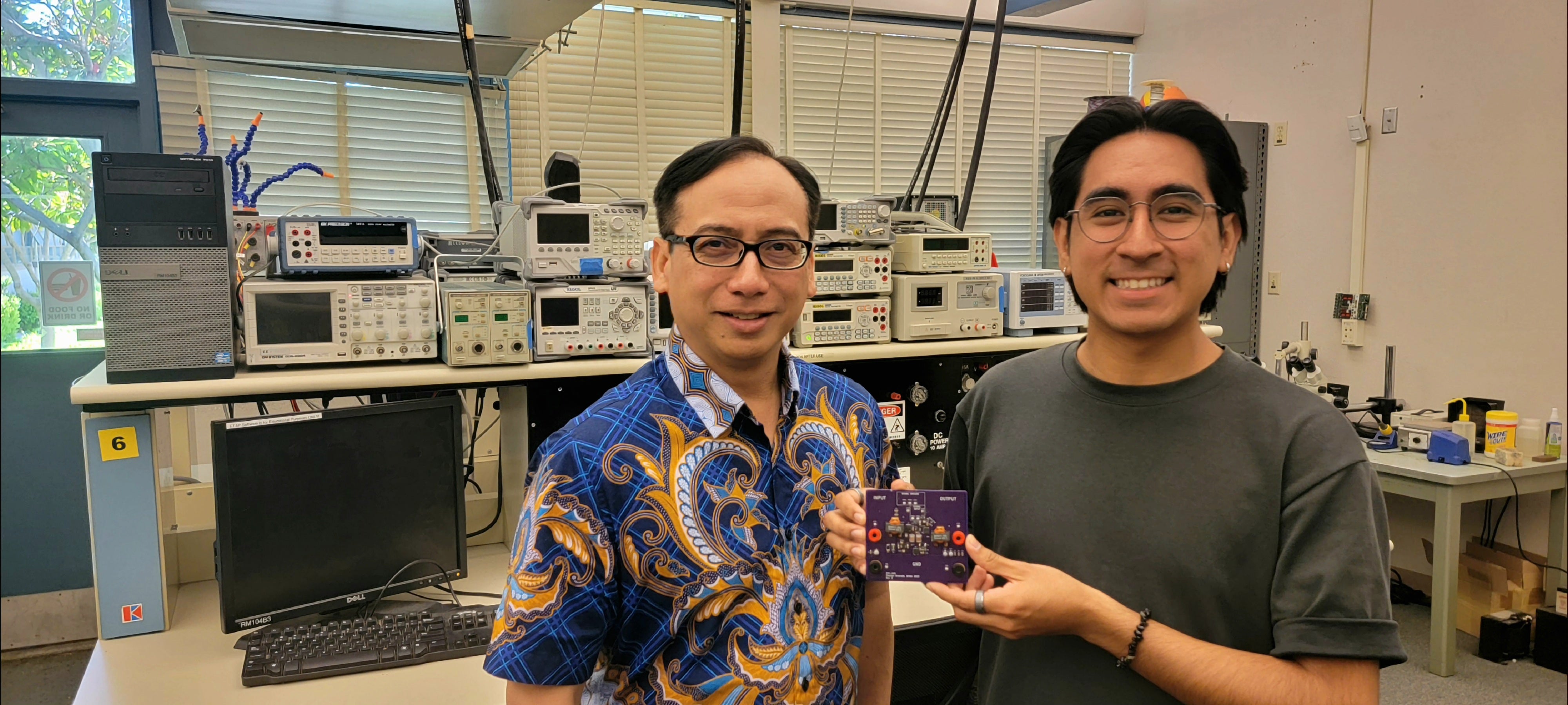 Professor and student display prototype of an energy conversion device