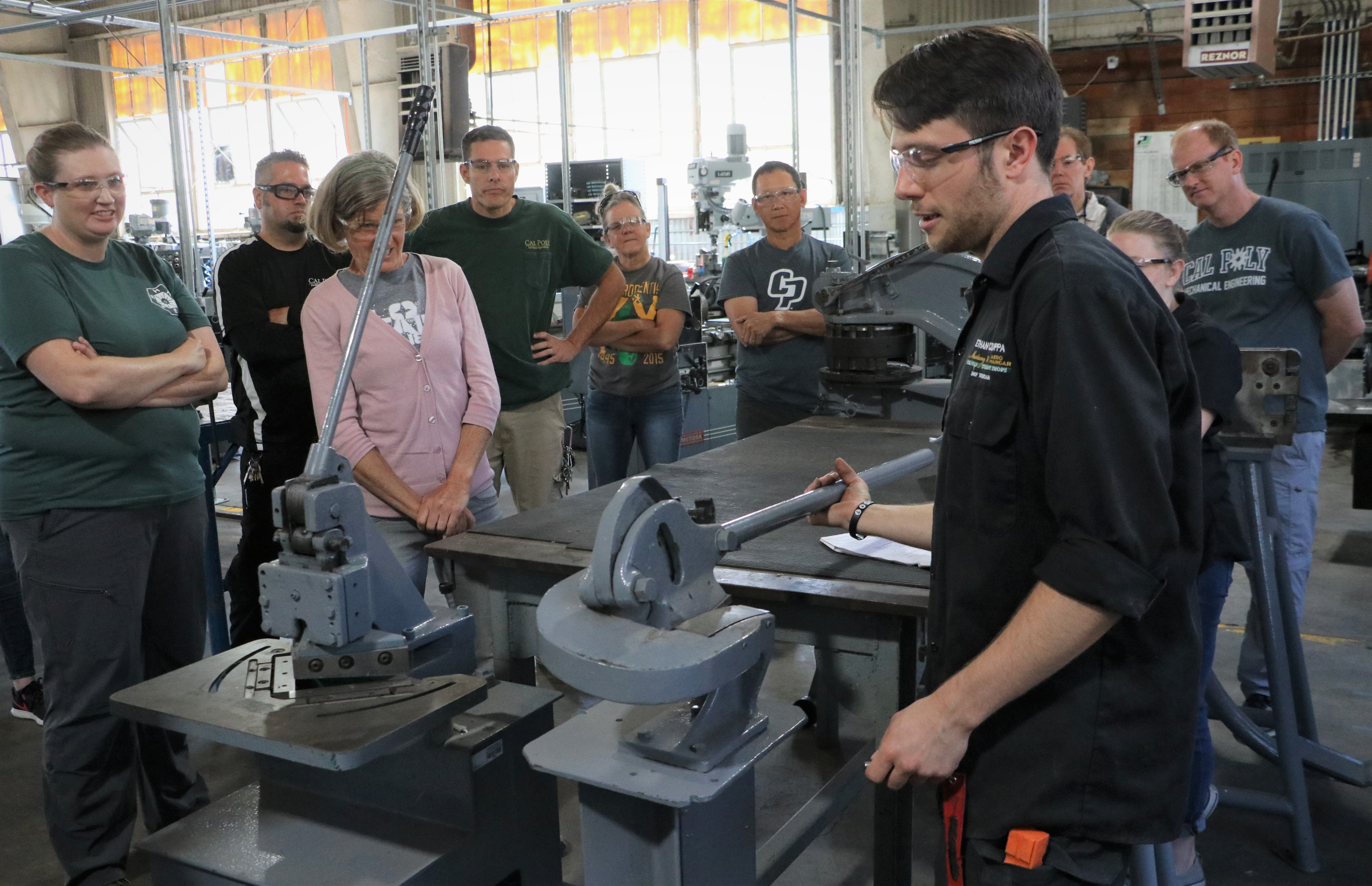 People in machine shop.