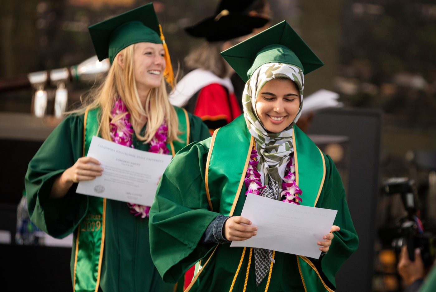 Students receiving diplomas during Commencement ceremony