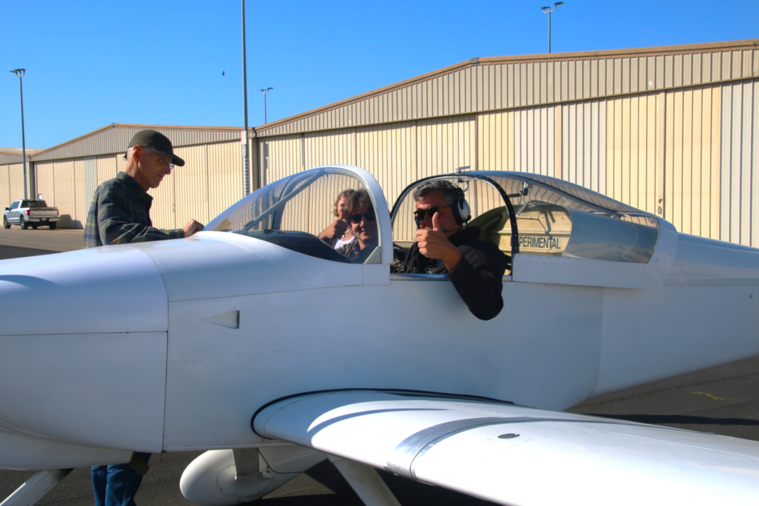 Professors and student prep airplane for test flight
