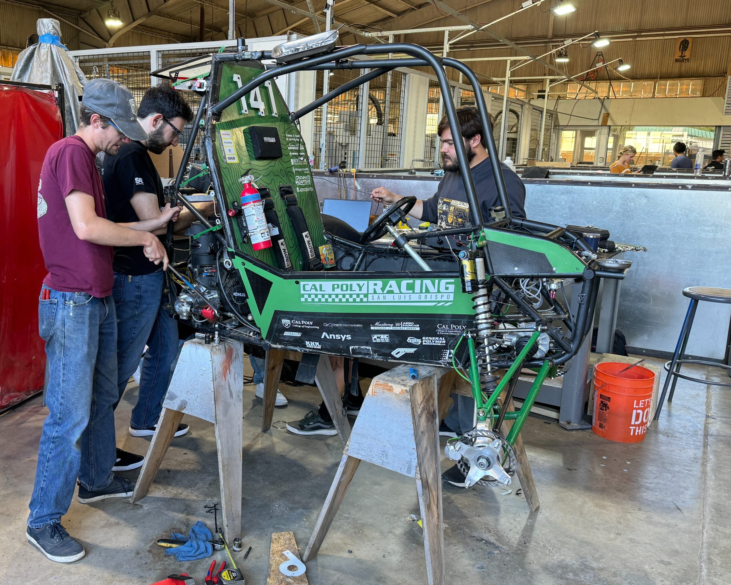 Students in the Hangar machine shop prepare the vehicle for their next race in Pennsylvania 