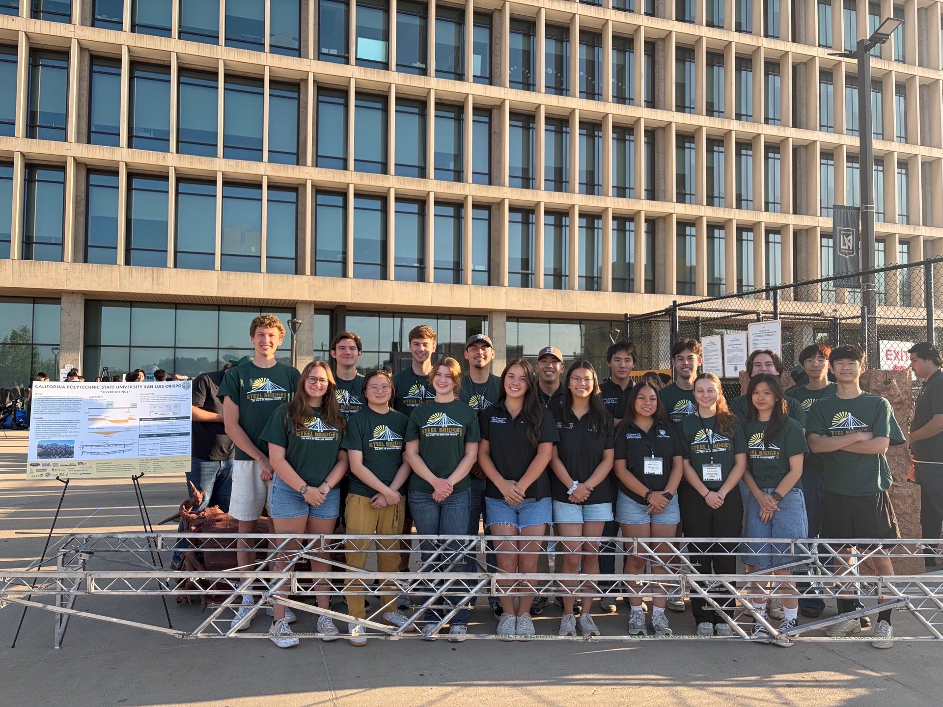 Members of steel bridge team pose for group shot with their project