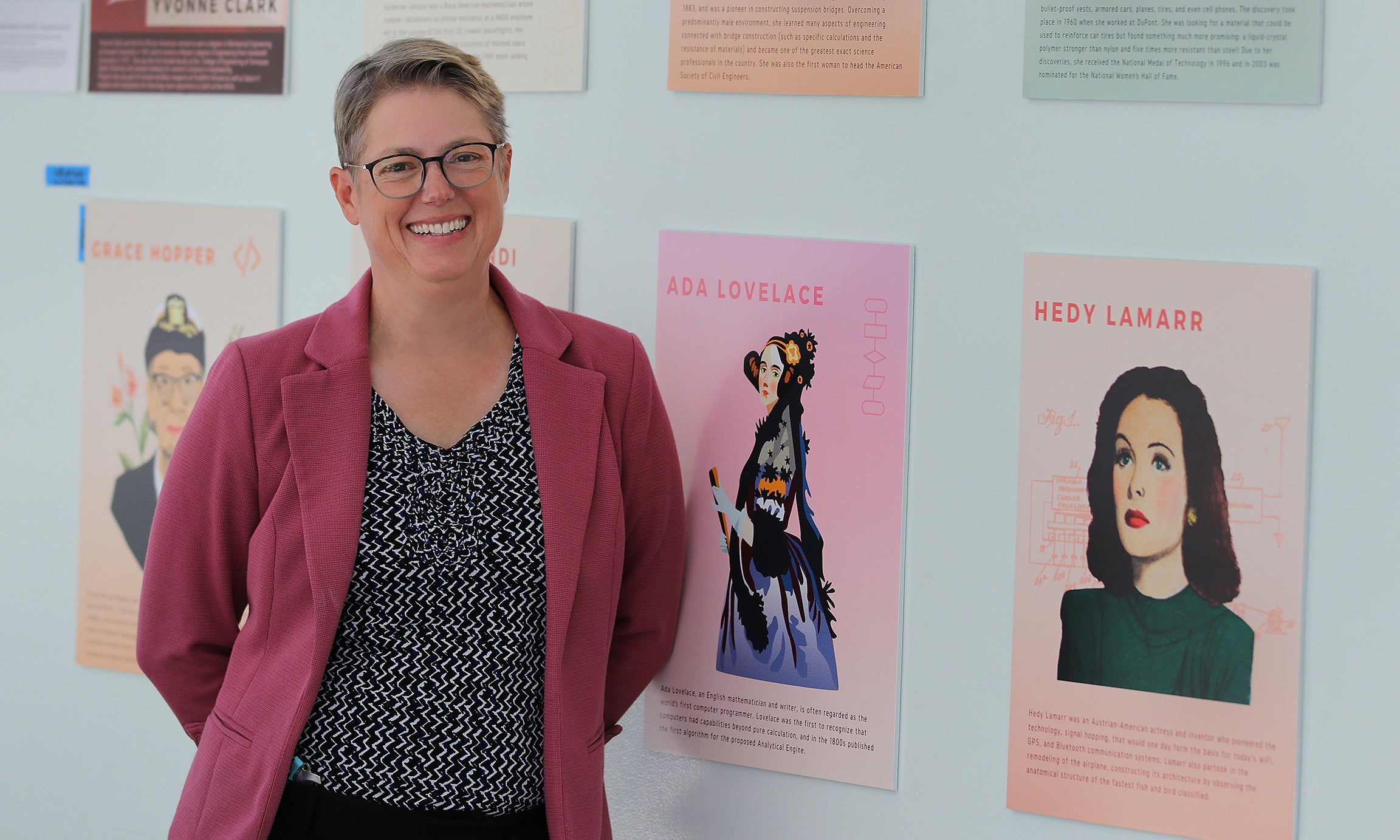Dean stands by photos of important women in engineering