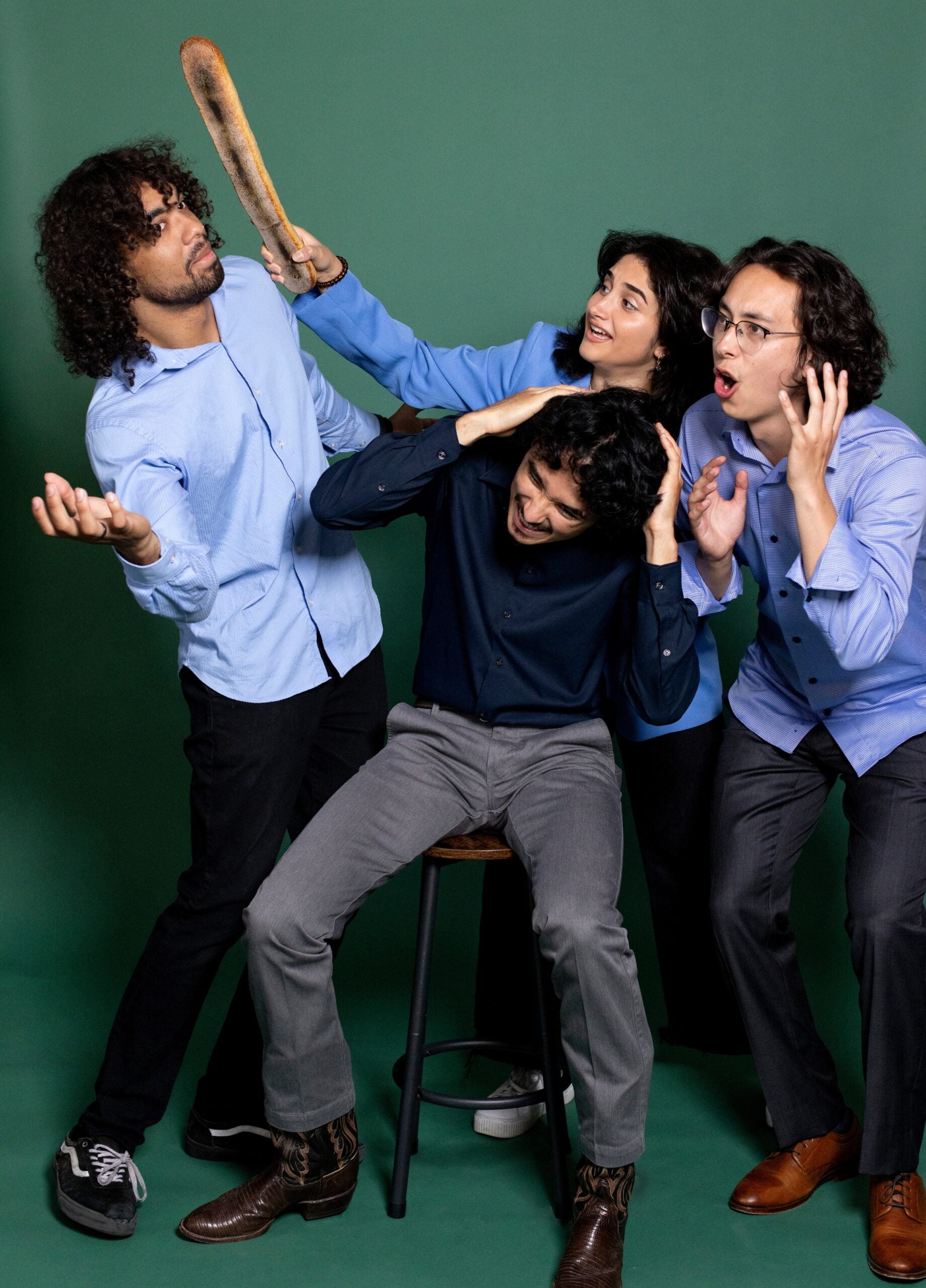 SafePlate co-founders goof around with a loaf of bread during a portrait session