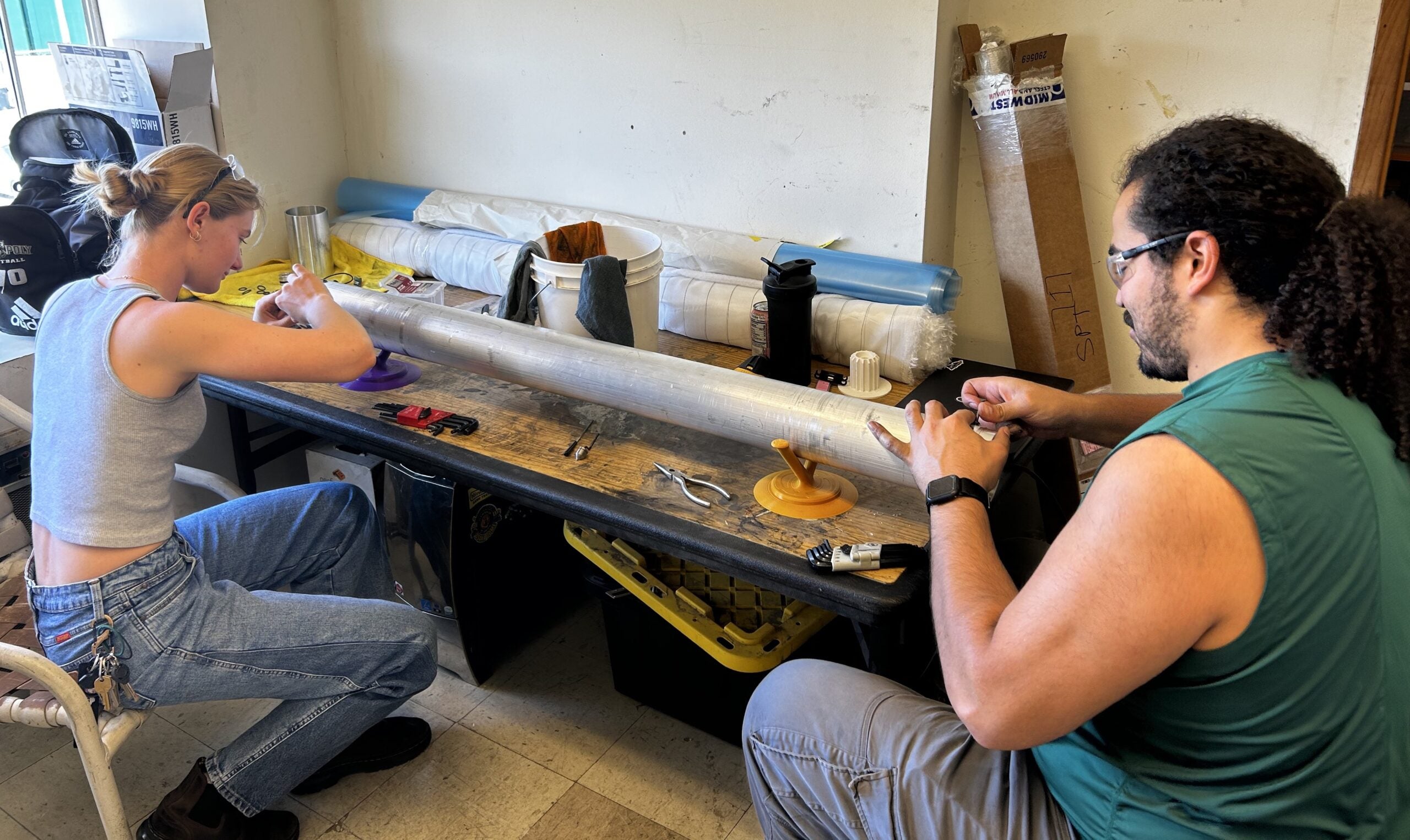 Students fit the tank and bulkhead together 
