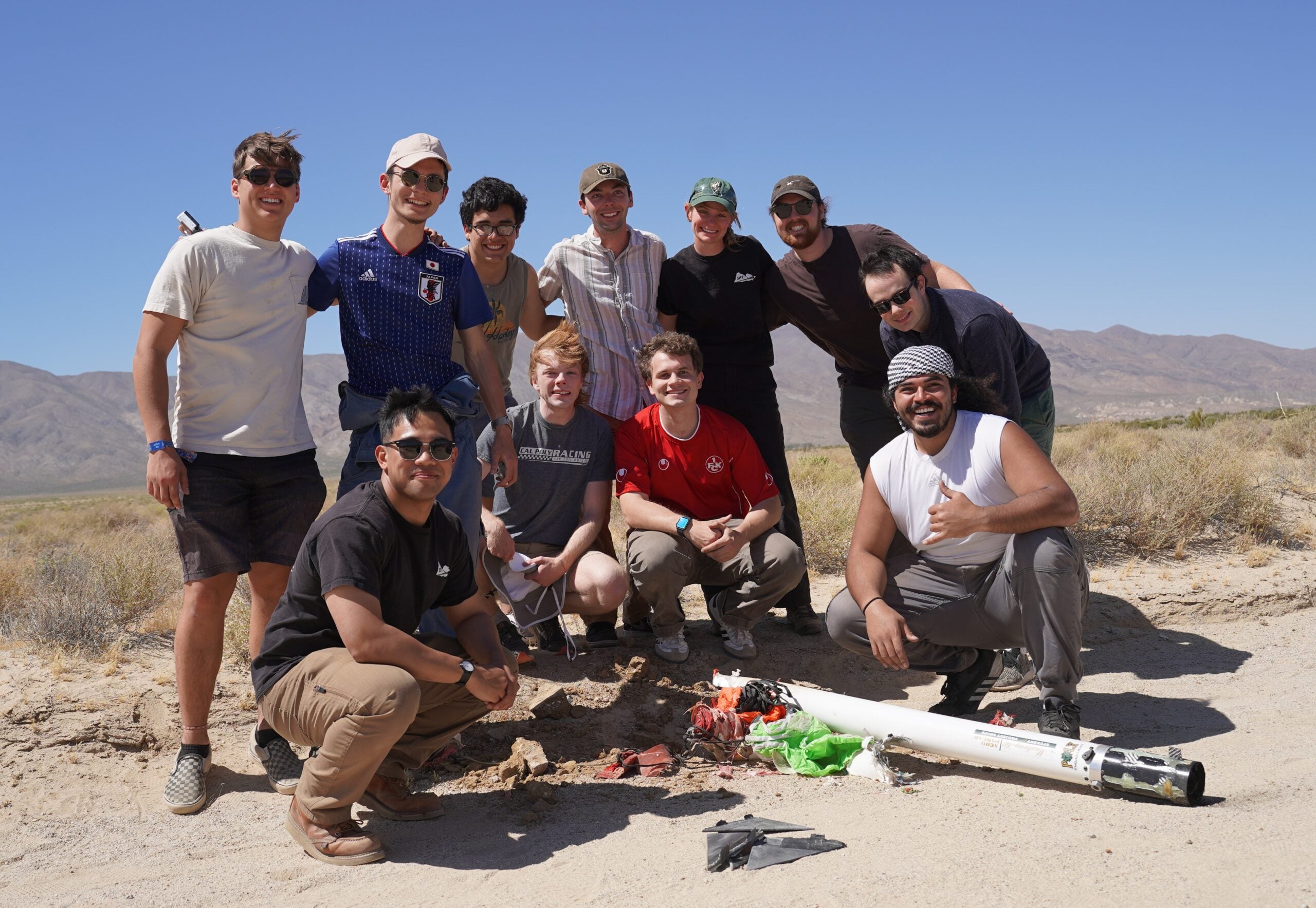 Let it Loose members recover their rocket after it lands in the Mojave Desert