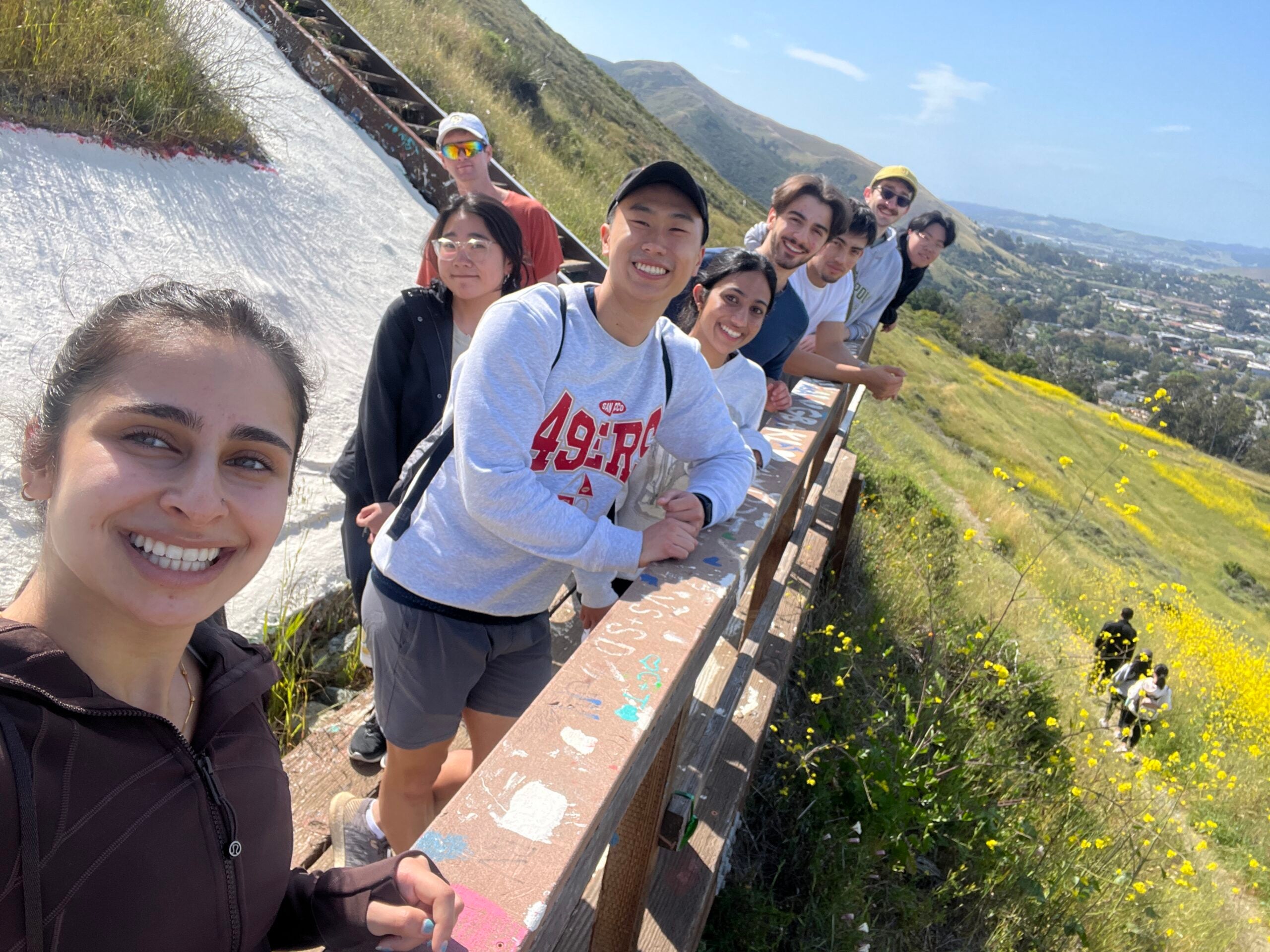 Hack4Impact students pause at the Cal Poly “P” 