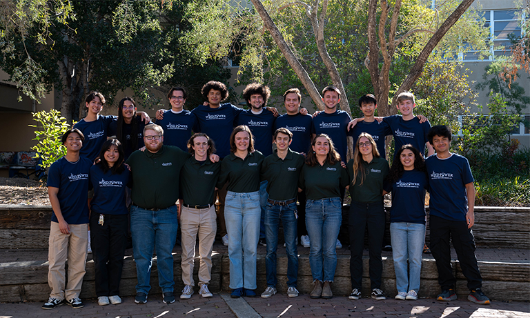 A group of students in two rows posing