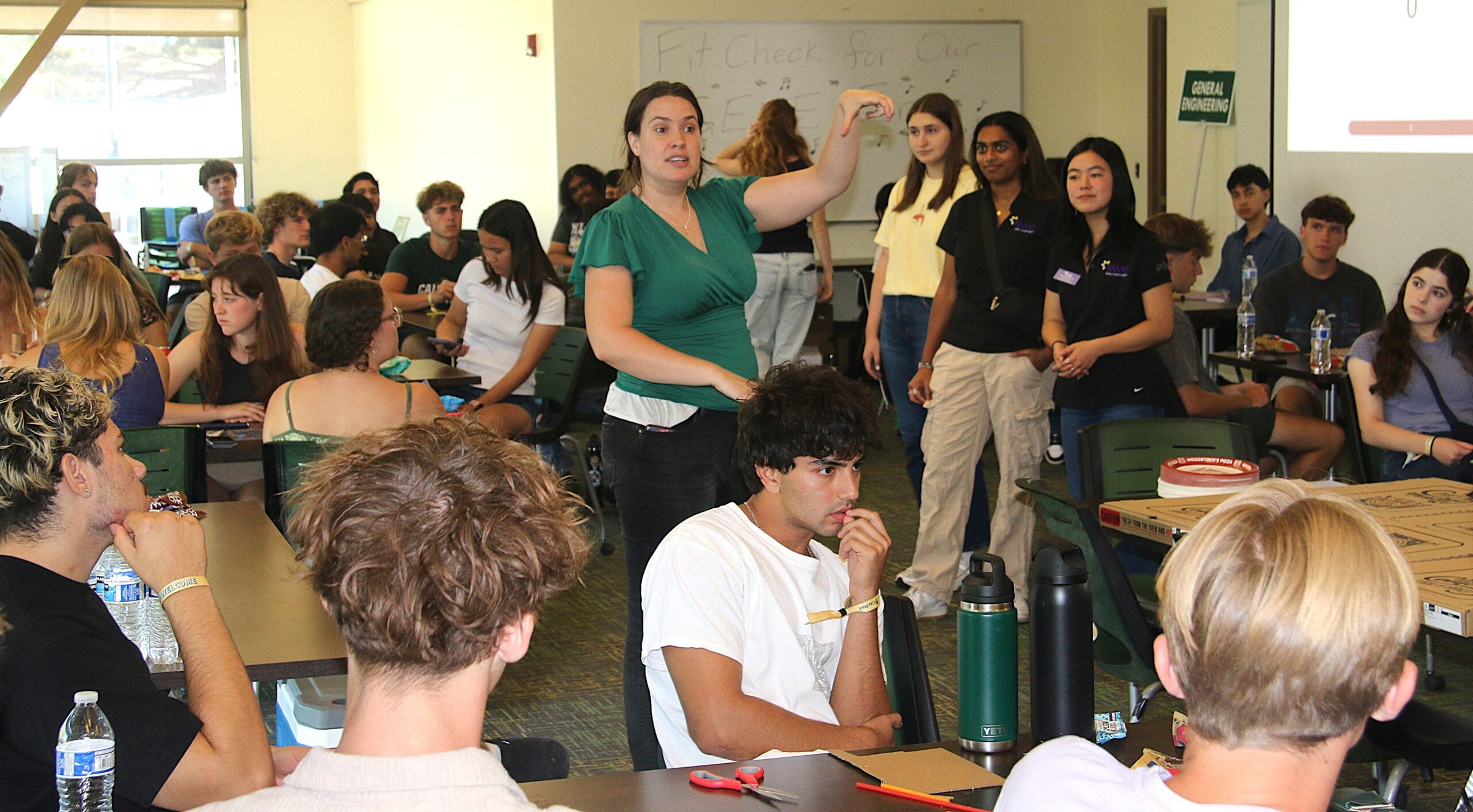 Professor directs students during the Week of Welcome event