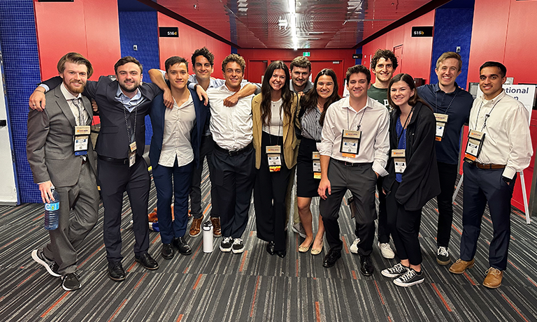 A group of students smiling and posing