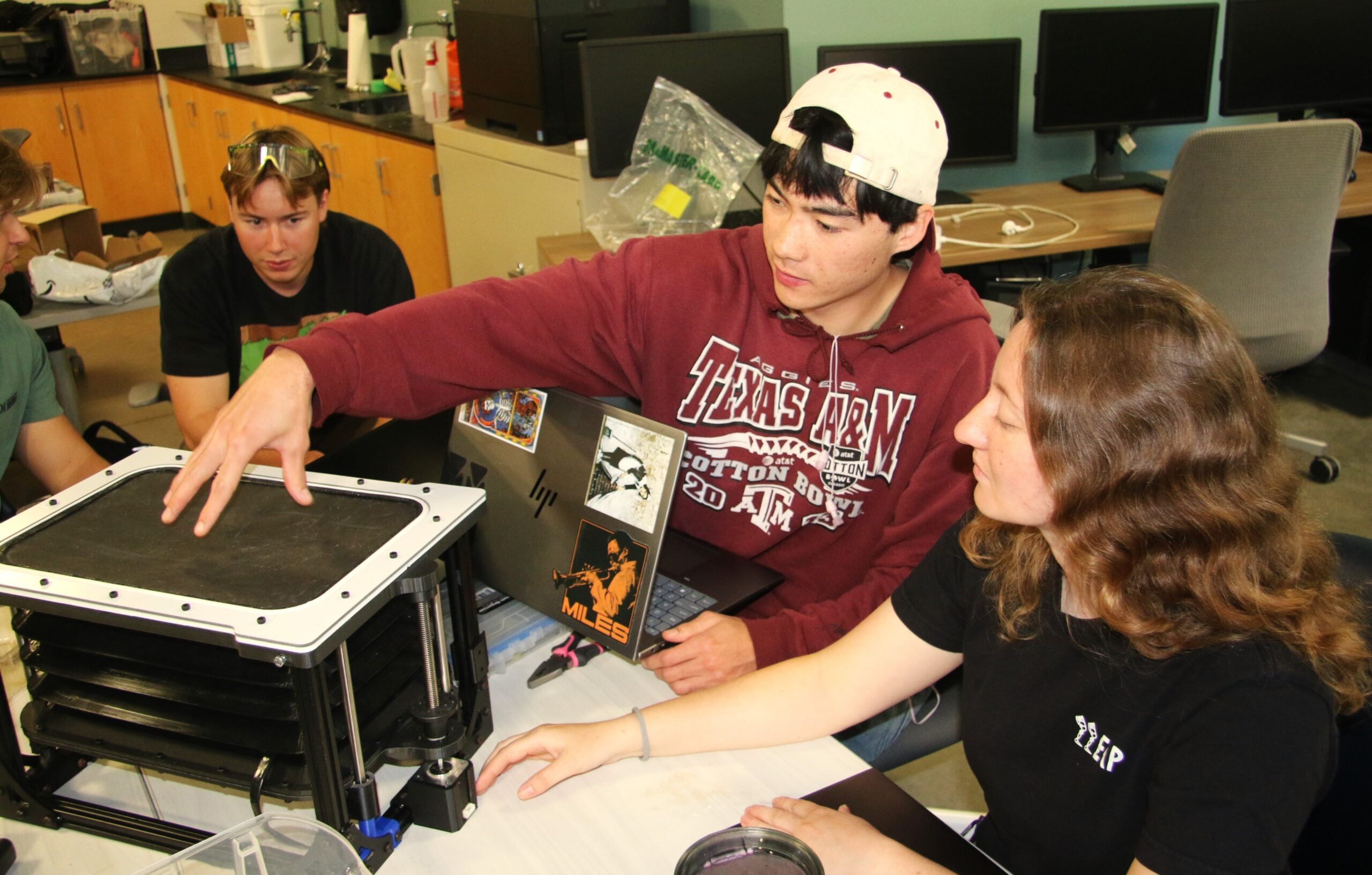 Students work on prototype in lab