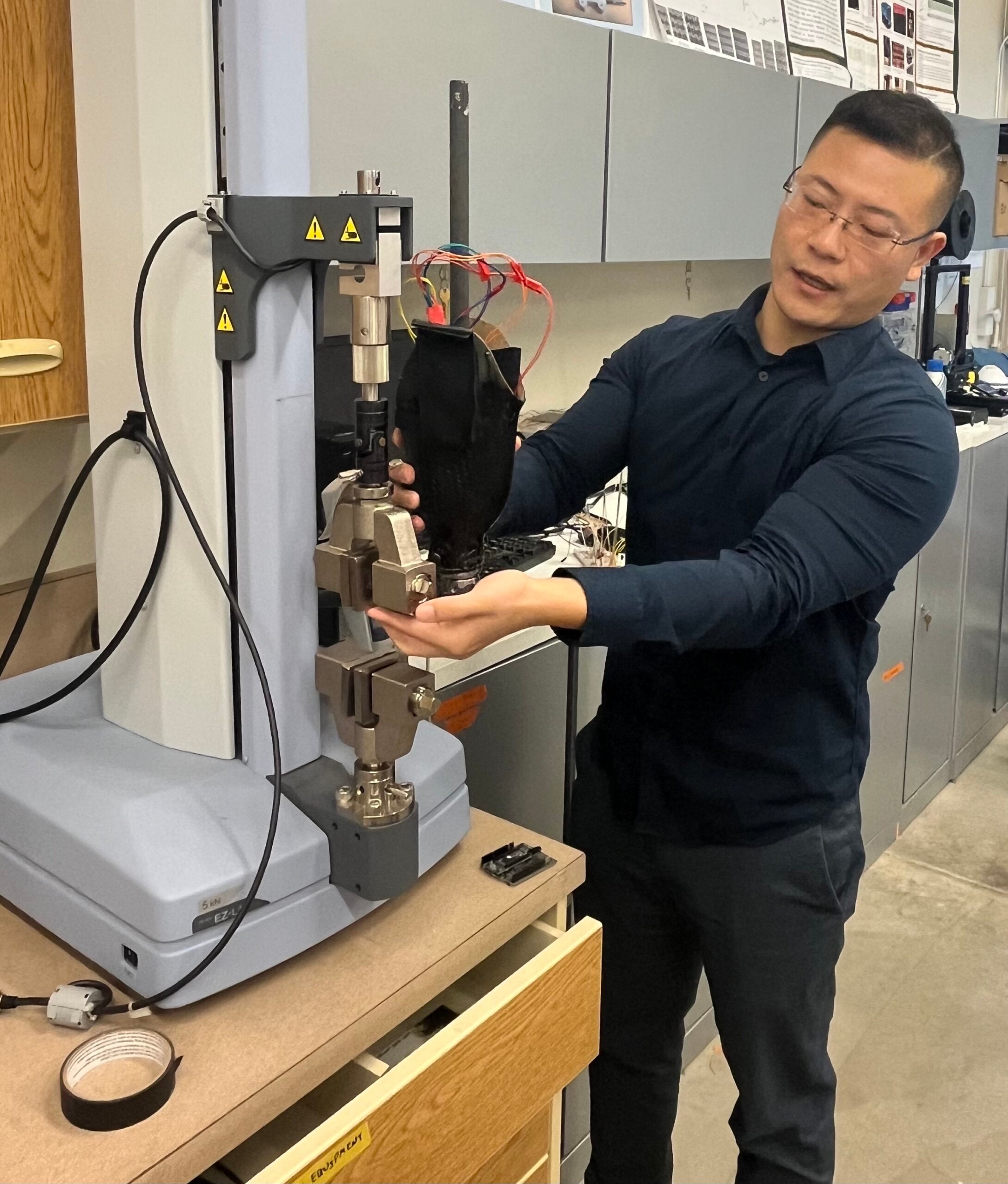 Professor shows a machine that will be used in testing on prosthetics
