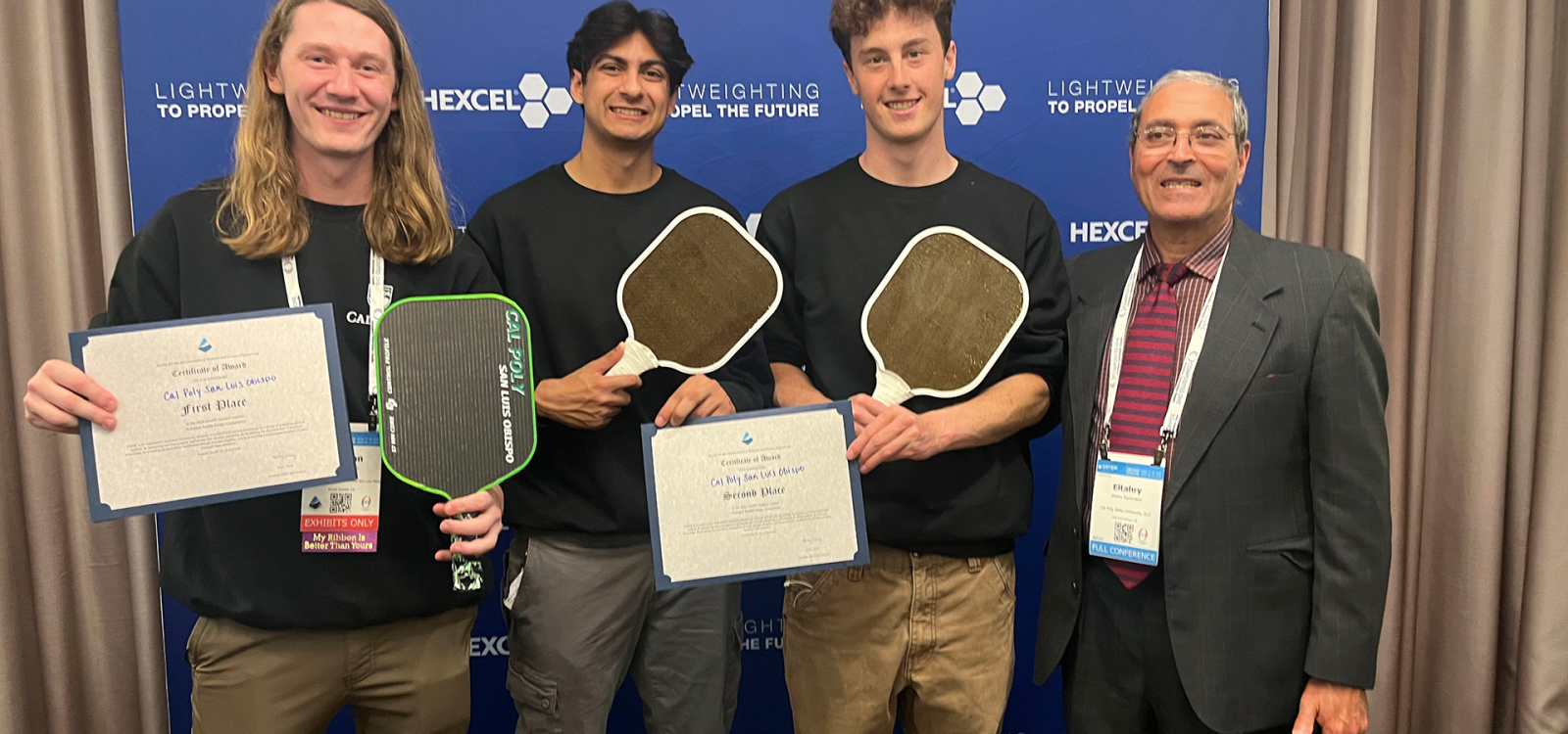 Donovan Furtado, from left, Caleb Singh, Conor Junge and mechanical engineering professor Eltahry Elghandour celebrate Cal Poly’s top two finishes in SAMPE’s inaugural Student Pickleball Paddle Design Competition. Furtado placed first, while Singh and Junge earned second.