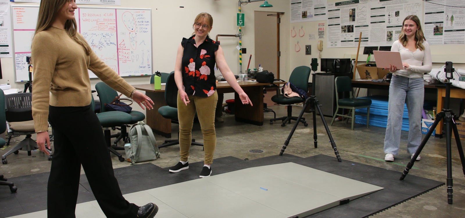 Professor directs student during gait analysis experiment