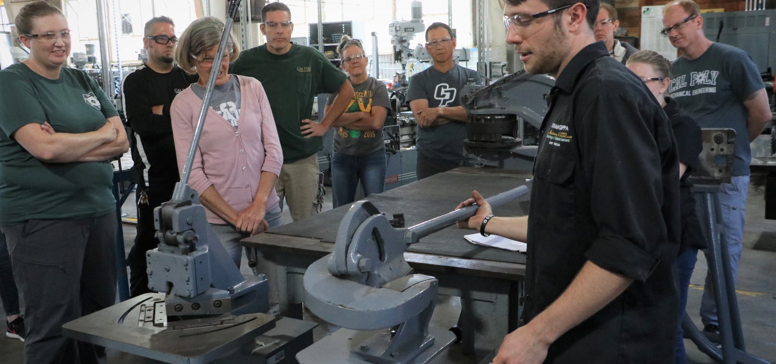 People in machine shop.