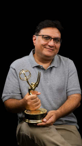 Professor holds Emmy statue