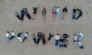 Cal Poly Wind Power members spell out the club’s name, reflecting the team culture behind its first overall win at the 2026 Collegiate Wind Competition Western Regional.