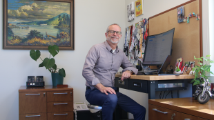 Professor sitting at his office desk