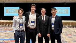 From left, industrial engineering students Daniel Hopkins, Tommy Gallagher and Michael Vieira represent Cal Poly with assistant professor Zhiyuan Wei at the 2026 Production and Operations Management Society Annual Conference.