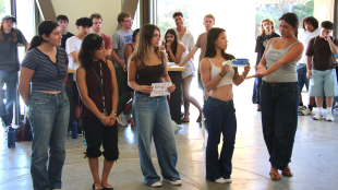 Students pitch their shoe during a WOW event