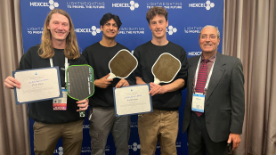 Donovan Furtado, from left, Caleb Singh, Conor Junge and mechanical engineering professor Eltahry Elghandour celebrate Cal Poly’s top two finishes in SAMPE’s inaugural Student Pickleball Paddle Design Competition. Furtado placed first, while Singh and Junge earned second.